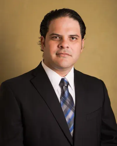 Portrait of Lic. Luis Loria, Corporate Counsel coordinating certified translations of corporate charters and RNIE filings in Mérida